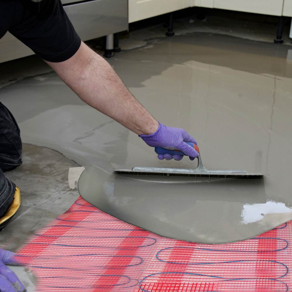ARDITEX NA levelling and smoothing compound going over underfloor heating elements
