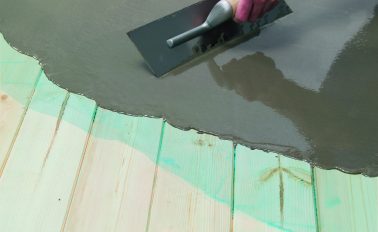 Fibre reinforced smoothing compound applied to wooden floorboards