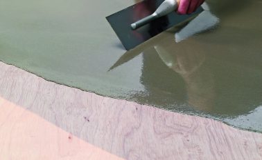 Fibre reinforced smoothing compound applied to plywood flooring