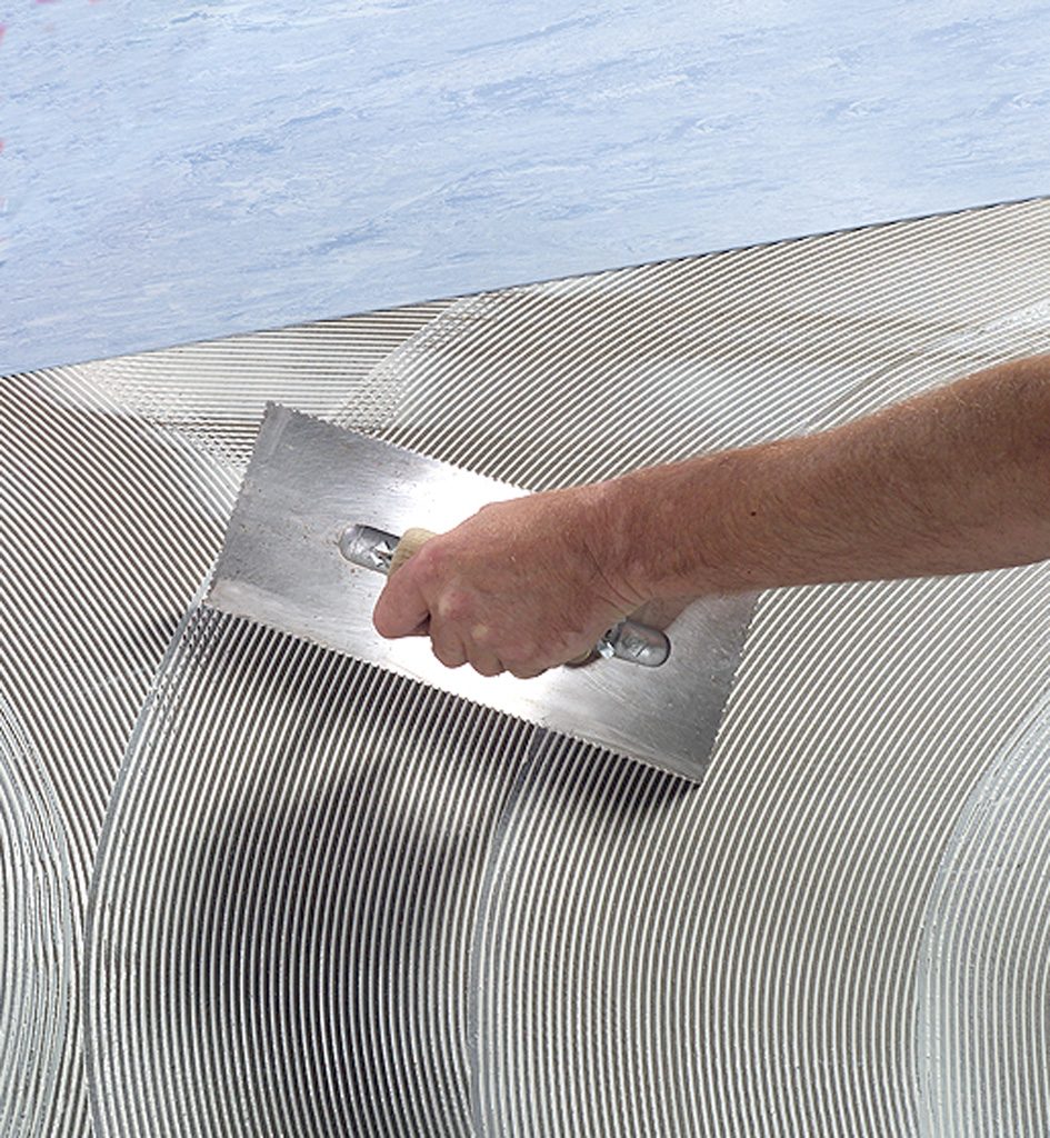 Application of lino adhesive