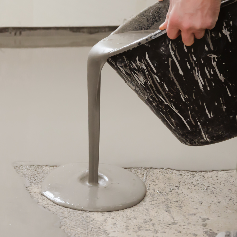 Ardex-A-70-Gypflo-screed-being-poured-from-bucket