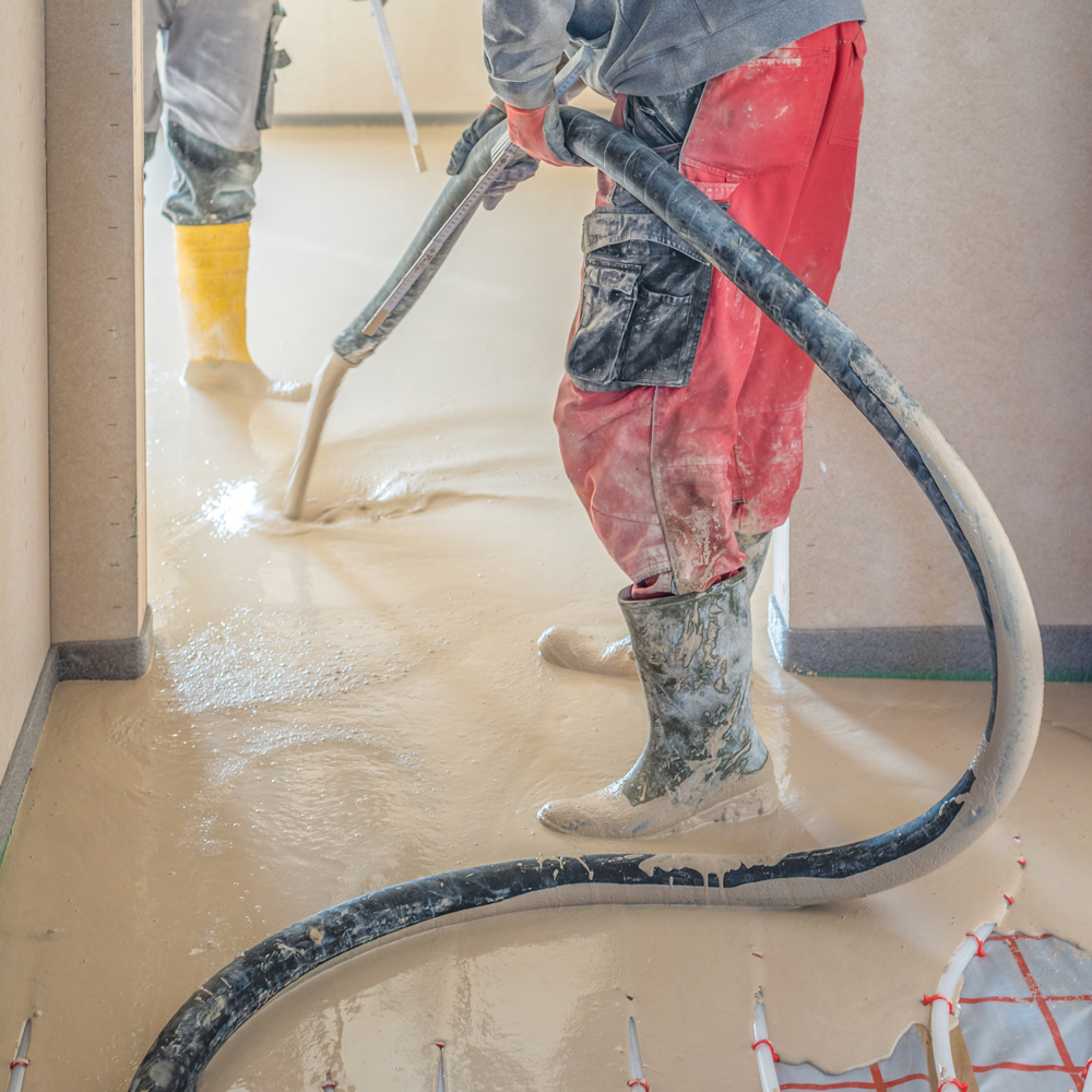 Ardex A 70 Gypflo screed being pumped on 1st floor
